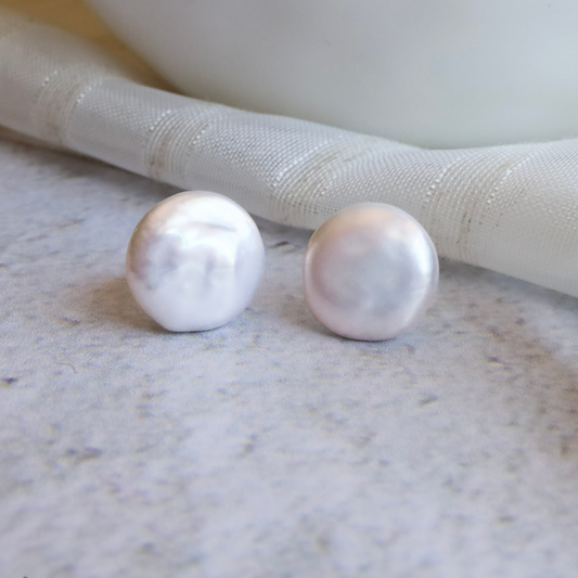 Freshwater Pearl Coin Earrings - Unique Luxury for the Modern Fashionista. Featuring lustrous freshwater pearls in a unique coin shape, these exclusive earrings add a touch of luxury to any outfit.