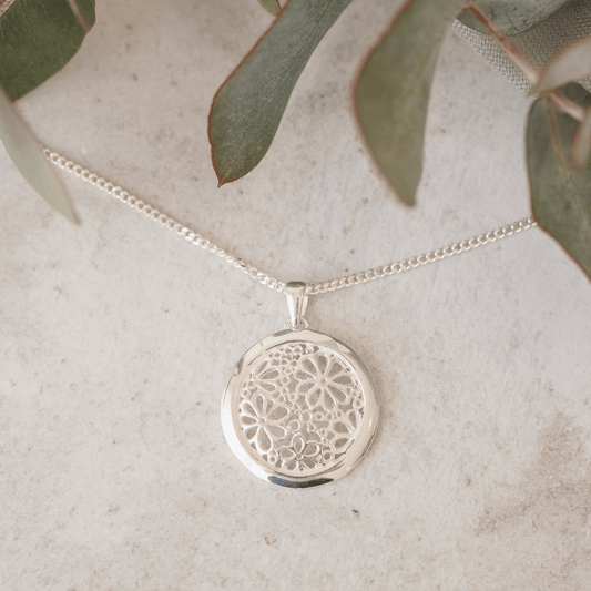 Sterling Silver Daisies in a Ring Pendant