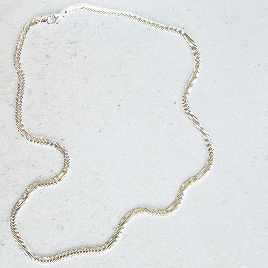 Sterling Silver 4mm Snake Necklace - Timeless Sophistication and Effortless Style. This stunning piece is crafted with exquisite detail, showcasing a sleek and elegant design that will elevate any outfit.