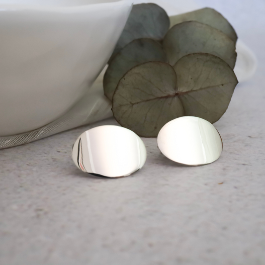 Sterling Silver Oval Stud Earrings - Expertly crafted from premium sterling silver, adding a touch of luxurious elegance to any outfit.