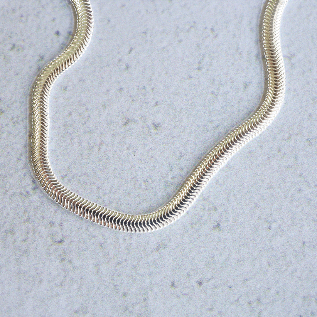 Sterling Silver 4mm Snake Necklace - Timeless Sophistication and Effortless Style. This stunning piece is crafted with exquisite detail, showcasing a sleek and elegant design that will elevate any outfit.