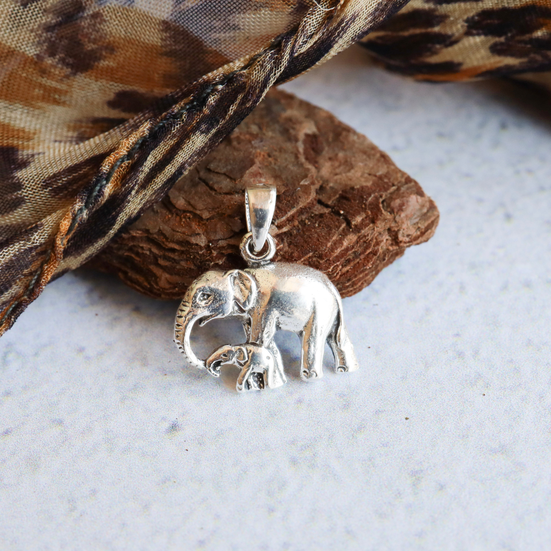 Sterling Silver Solid Elephant with Baby Pendant - Stunning depiction of a mother elephant and her baby expertly crafted from the finest sterling silver, adding a touch of elegant sophistication to any outfit